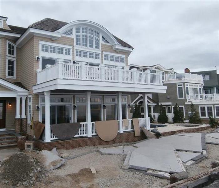 Exterior damage to a home after a hurricane.