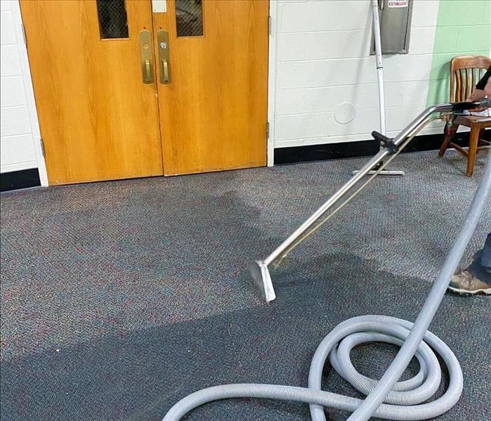 SERVPRO tech extracting water from a carpet in Philadelphia