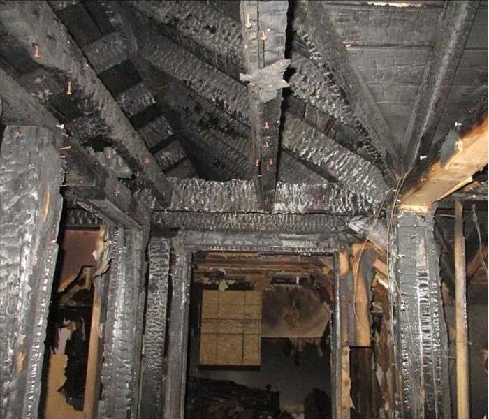 wooden structure of a bathroom burned