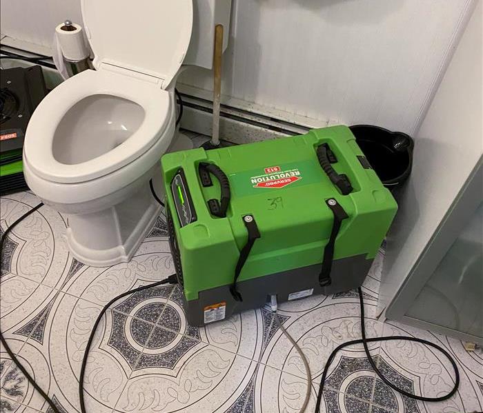 SERVPRO equipment and air movers set up in a bathroom after a pipe burst in Philadelphia, PA.
